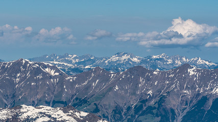 Obraz premium Switzerland, panoramic view on snow Alps with clouds