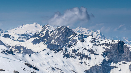 Fototapeta premium Switzerland, panoramic view on snow Alps with clouds