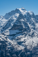 Obraz premium Switzerland, panoramic view on snow Alps with clouds