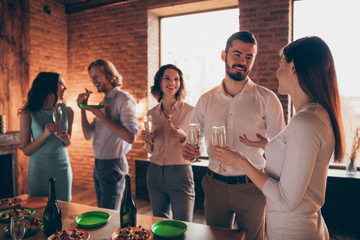 Company of several nice-looking attractive lovely pretty elegant cheerful positive guys ladies pal having fun best birthday house tradition custom table buffet snack in industrial loft interior room