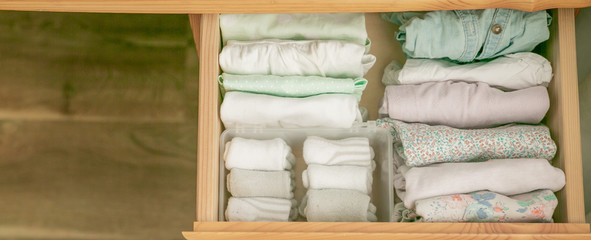 Marie Kondo tyding up method concept - folded clothes, copy space