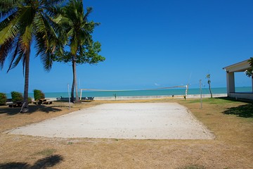 Beach volleyball on the beach with blue sky and coconut tree