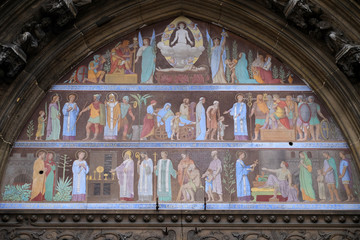 Fototapeta premium PARIS, FRANCE - JANUARY 07: Scenes from the life of Saint Laurent, Central Portal - Tympanum of the Saint Laurent Church, Paris, France on January 07, 2018.