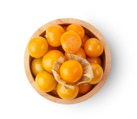 Cape Gooseberry -in wood bowl isolated on white background. top view