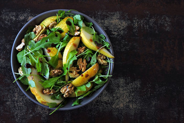 Vegan salad pear, arugula, walnut.