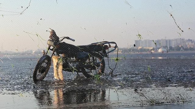 Old motorcycle in the coast of Persian Gulf in Bandar-Abbas city. Iran
