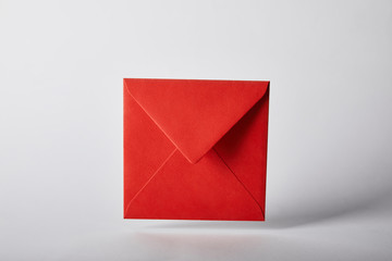 red and colorful envelope on grey background with copy space