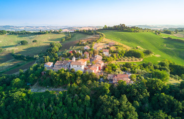Fototapeta na wymiar aerial view of a little town located in the italian countryside hills