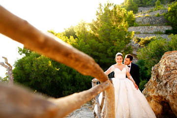 Beautiful wedding couple walking on the  old street. outdoor