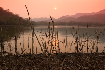 Villagers are catching fish by fish trap (net trap) in reservoir