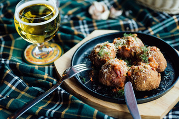 Stewed meatballs with vegetables on the table