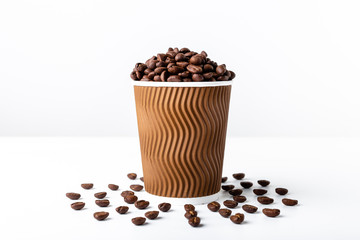 Craft coffee cup full of coffee bean on white background