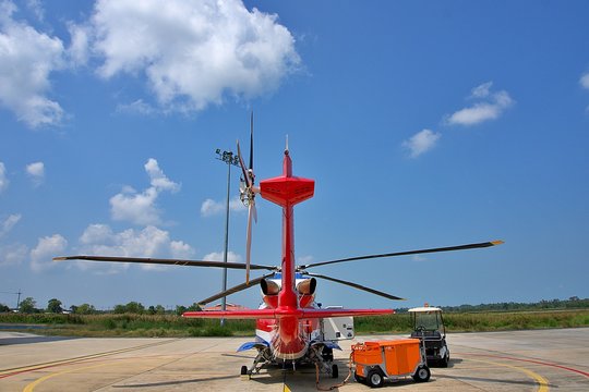 Helicopter parking on ramp.  Sikorsky s76 on sunny day and blue sky. Rear view of helicopter parking on ramp