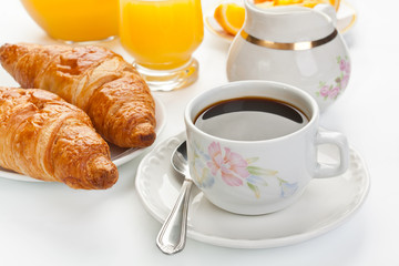 Breakfast with coffee and croissants