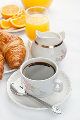 Breakfast with coffee and croissants
