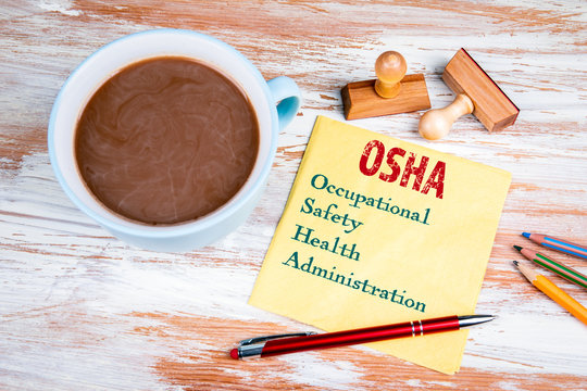 OSHA Occupational Safety And Health Administration  Concept. Text On A Napkin With A Cup Of Coffee