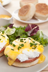 Eggs Benedict- toasted English muffins, ham, poached eggs and  hollandaise sauce