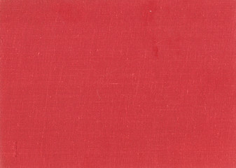 Red color old grungy canvas pattern with dirty spot.