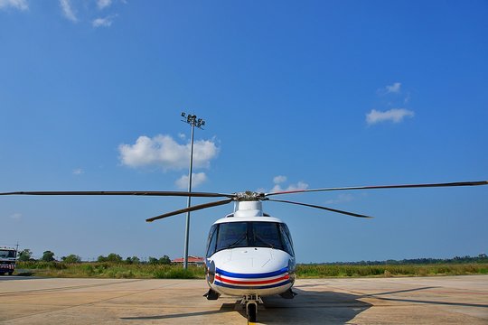Helicopter parking on ramp.  Helicopter on sunny day and blue sky. Front view of helicopter parking on ramp