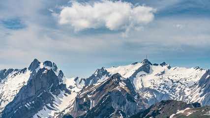 Switzerland, Beautiful scenic view on snow Alps peaks with blue sky and white clouds above
