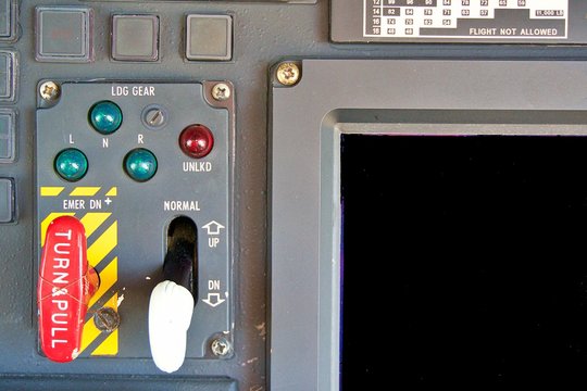 Helicopter's landing gear control panel. Helicopter S76 landing gear control. Helicopter cockpit.