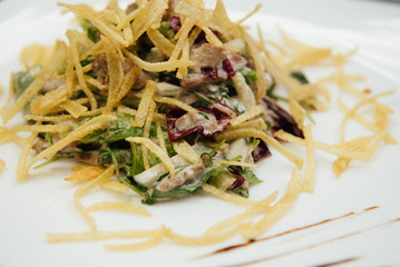 maultaschen and greens on a plate on the table