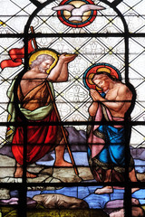 Obraz na płótnie Canvas Baptism of the Christ, stained glass window in the Basilica of Notre Dame des Victoires in Paris, France 