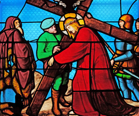 5th Stations of the Cross, Simon of Cyrene carries the cross, stained glass windows in the Saint...