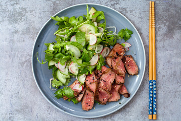 Asian beef  with cucumber salad