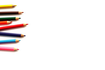 Crayons lined up isolated on white background.