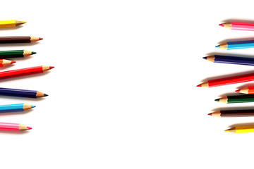 Crayons lined up isolated on white background.