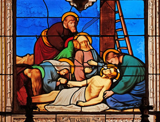 Fototapeta na wymiar 13th Stations of the Cross, Jesus' body is removed from the cross, stained glass windows in the Saint Eugene - Saint Cecilia Church, Paris, France