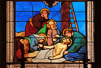 13th Stations of the Cross, Jesus' body is removed from the cross, stained glass windows in the...
