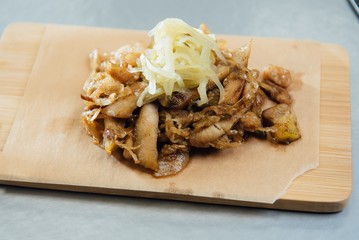 sprat with sauce on a cutting board on the table