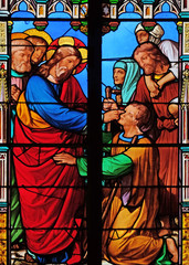 Fototapeta premium Jesus heals a blind man, stained glass windows in the Saint Eugene - Saint Cecilia Church, Paris, France