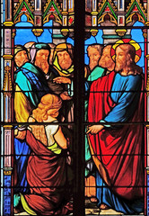 Obraz premium Forgiveness to the adulterous woman, stained glass windows in the Saint Eugene - Saint Cecilia Church, Paris, France
