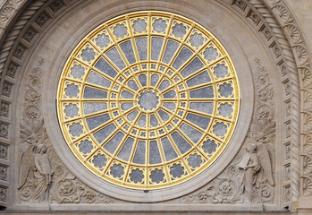 Rose window on the facade of Saint Augustine church in Paris, France 