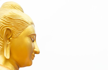Golden Buddha statue face close up