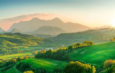 beautiful green mountains and hills landscape at sunset in italy, marche