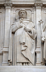 Saints Dominic, statue on the facade of Saint Augustine church in Paris, France 