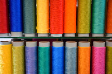 Large colorful polypropylene thread set in rainbow mood. Multicolor bobbin thread. Polypropylene multifilament yarns. Set of sewing thread coils, miscellaneous colours.