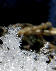 Thawed patch in the snow. Melting snow. Spring, slush, melted snow