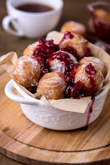 Tasty Homemade Cottage Cheese Donuts in Sugar Powder with Berry Jam Wooden Background Donuts Vertical