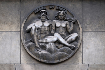 Ashur and Ninfa. Stone relief at the building of the Faculte de Medicine Paris, France 