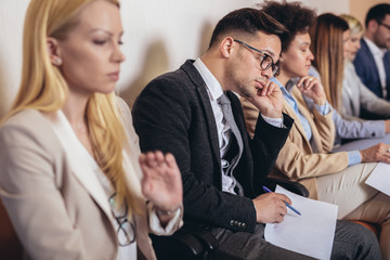 Photo of candidates waiting for a job interview. Selective focus
