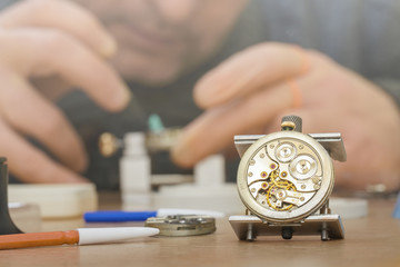 Professional watchmaker repairing watch