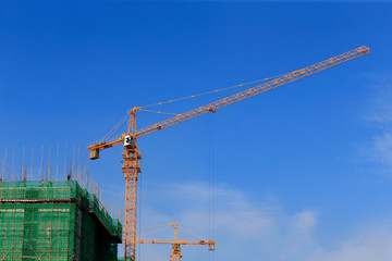 The crane is at work, at the construction site