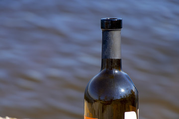 the neck of a bottle of wine already drunk