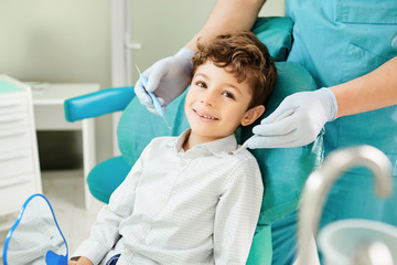 Child boy in the dental office smiling