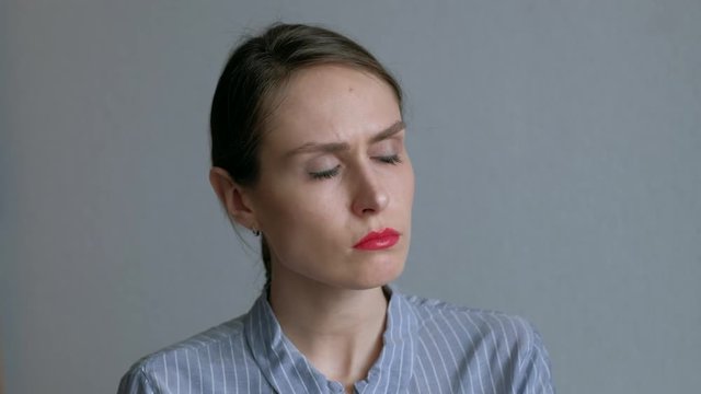 Portrait of sad woman with bright red lips. Female offended by something. 4k